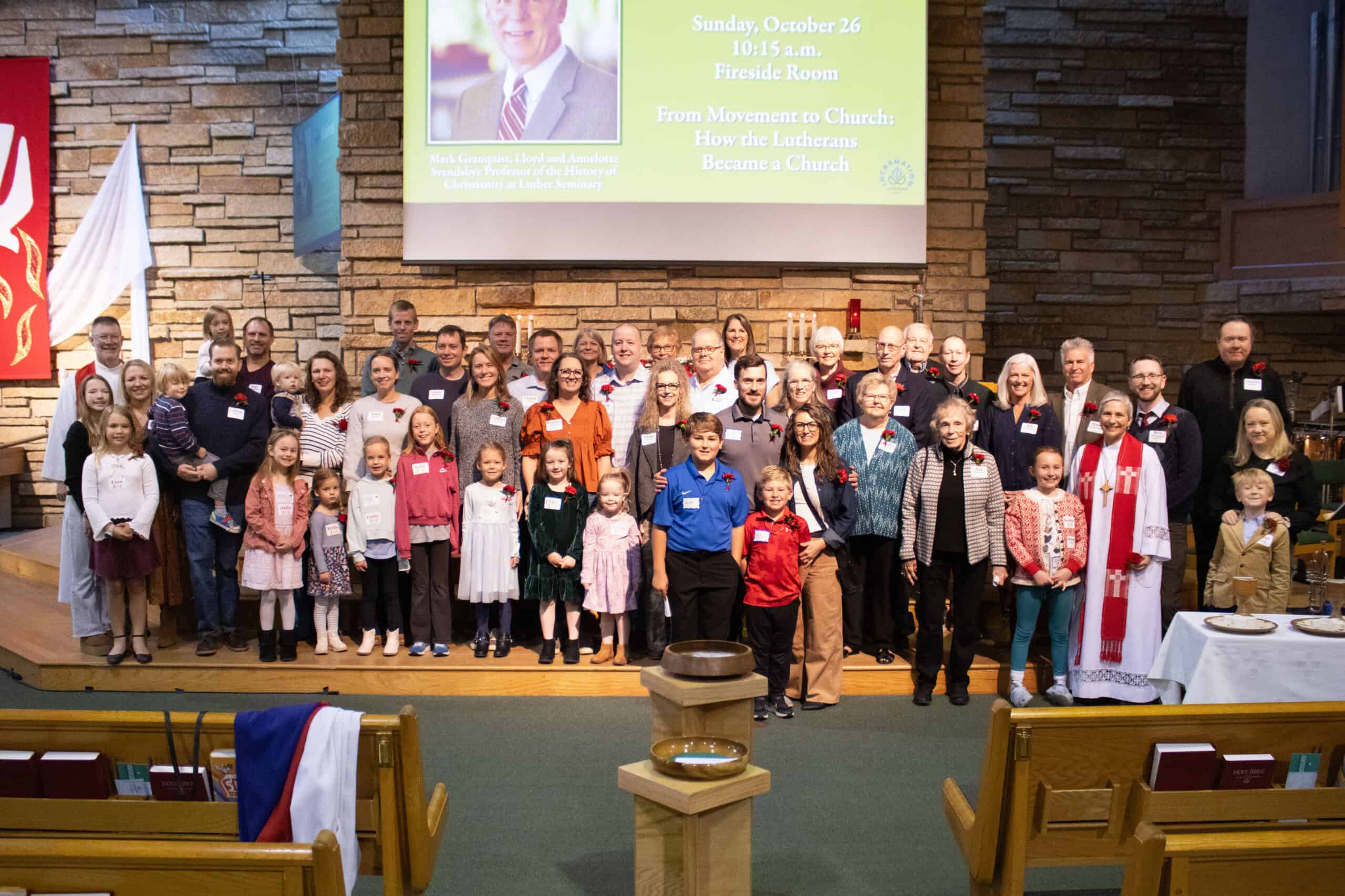 Group photo of congregation members and church leaders at Incarnation Lutheran Church during a Sunday service event.