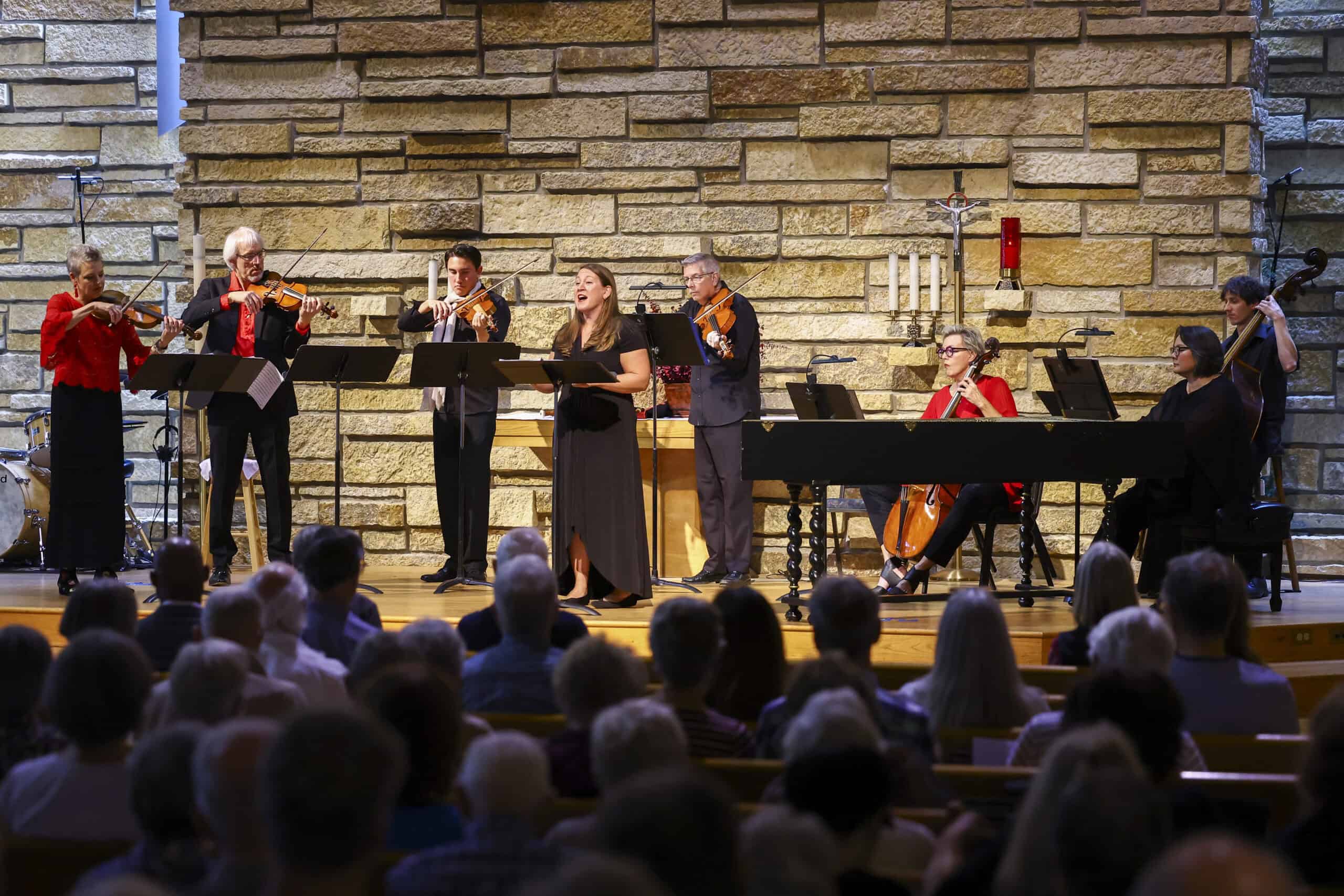 Vivaldi on Fire Musicians perform a classical concert at Incarnation Lutheran Church with an audience watching attentively.