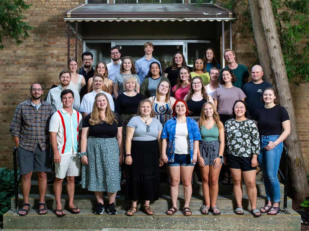 Diverse group of people standing on church steps, smiling, representing Incarnation Lutheran Church community.
